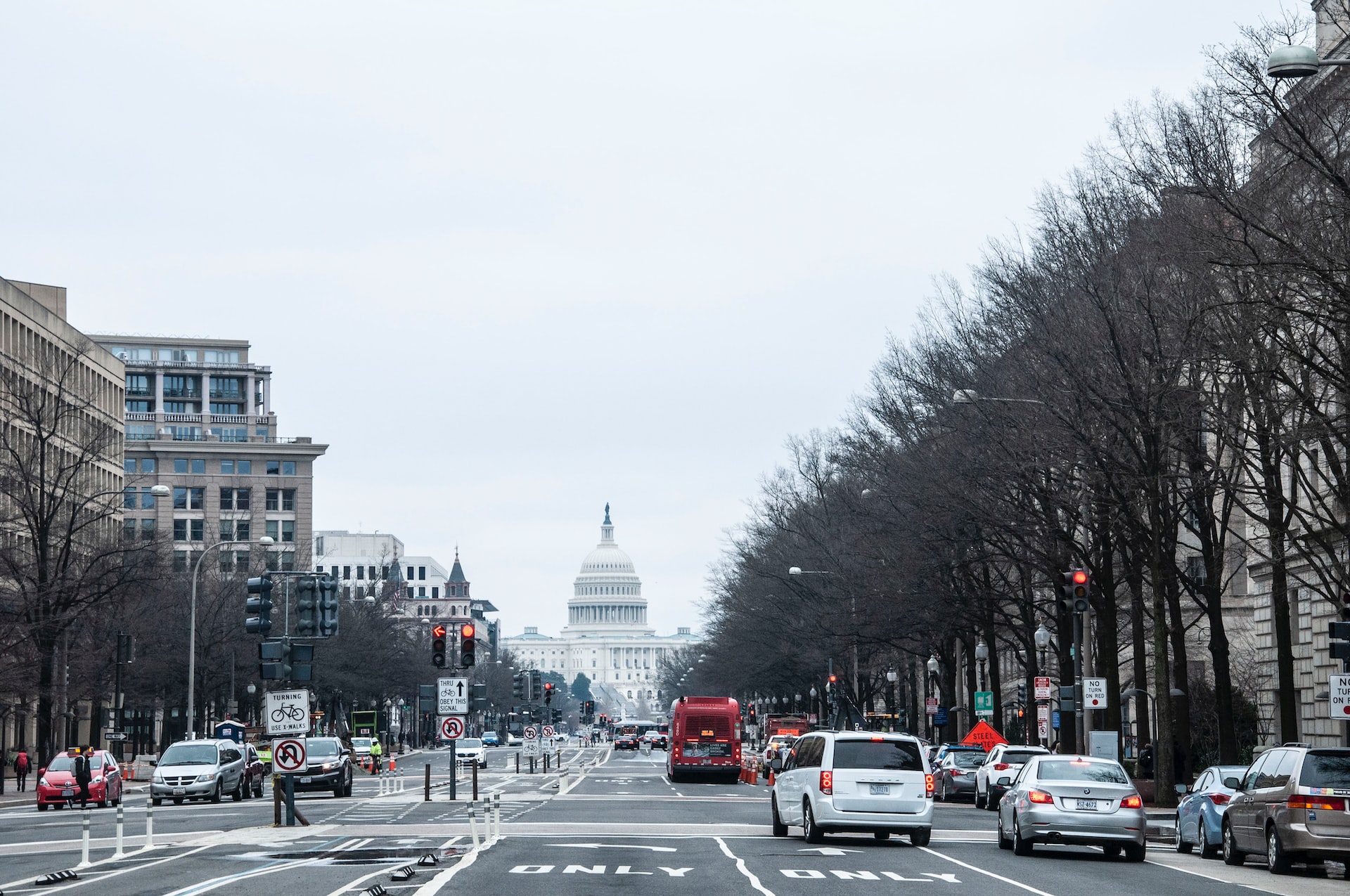 The U.S. Capitol building and a busy street on a winter day.