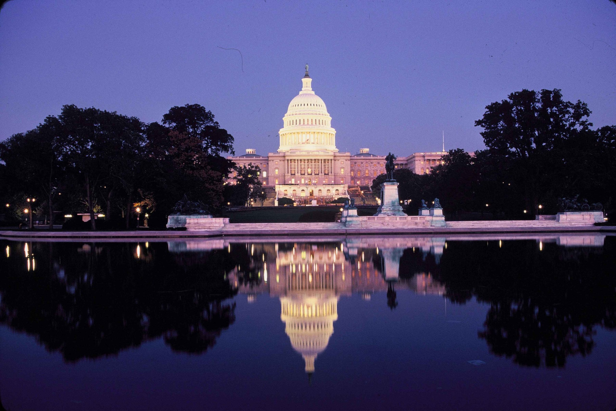 The U.S. Capitol Building at dusk and its reflection in the Reflecting Pool
