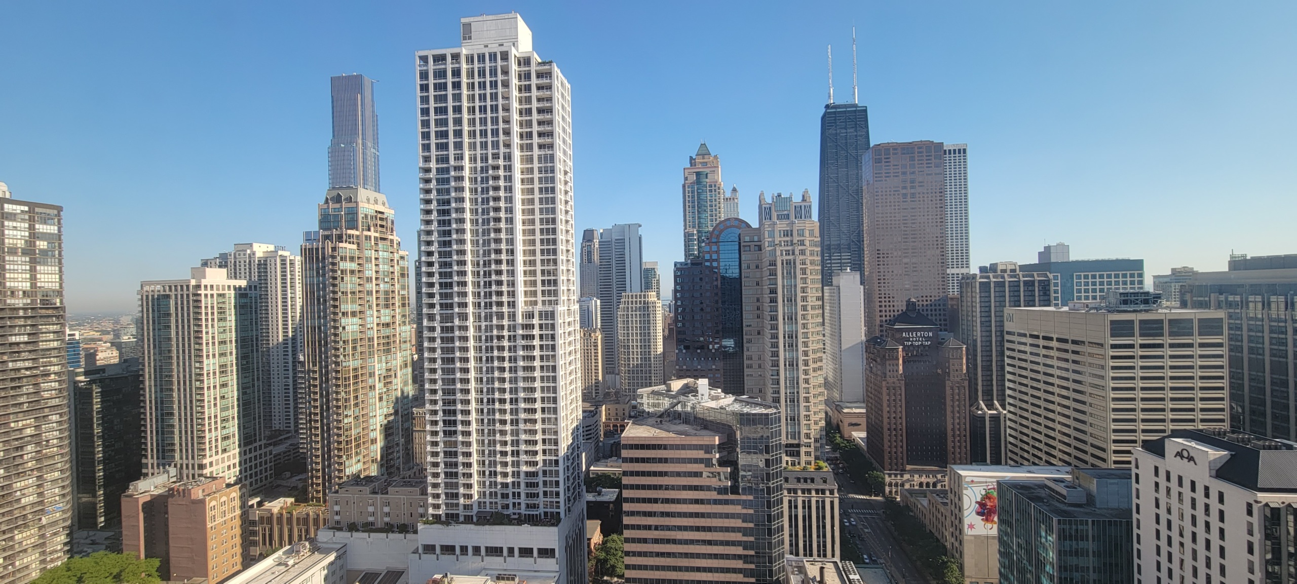 Photo of Chicago's skyline, facing north from the 38th floor of the Chicago Marriott Downtown, with several skyscrapers including the landmark Hancock Building