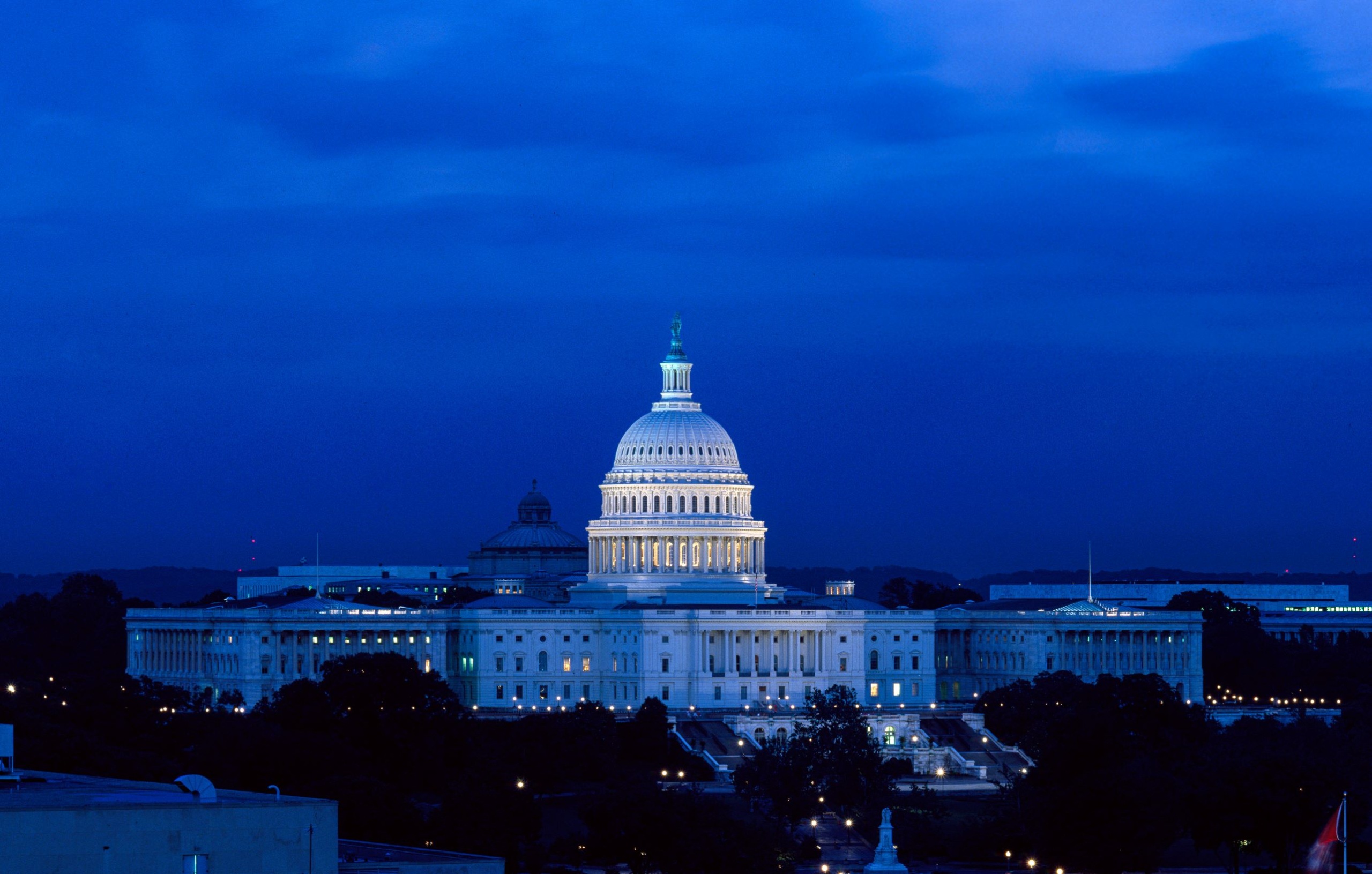 The US Capitol building at night.
