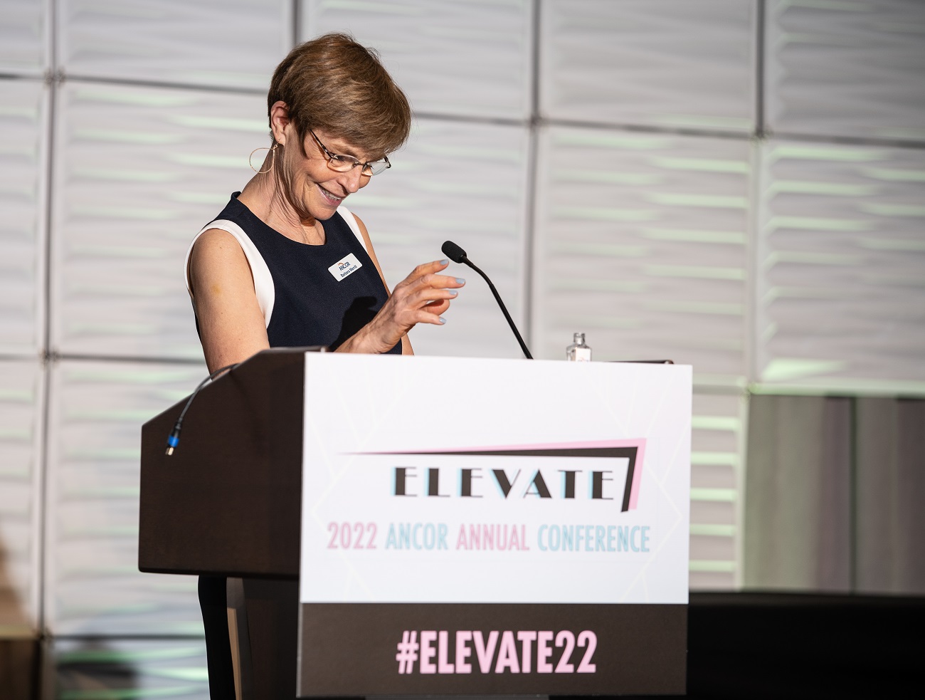 ANCOR CEO Barbara Merrill speaking from the podium at ANCOR's 2022 Annual Conference in Miami
