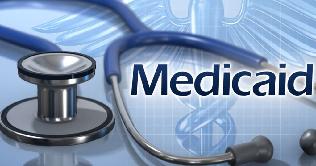 Stock photo of a stethoscope with the word 'Medicaid' on top