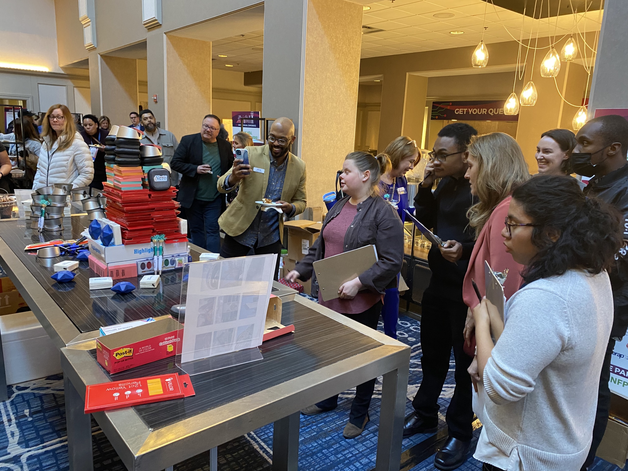 Participants building a skyscraper out of school supplies at the 2023 ANCOR Annual Conference