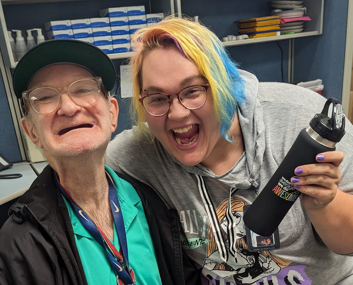A DSP smiling for a picture next to a person they support