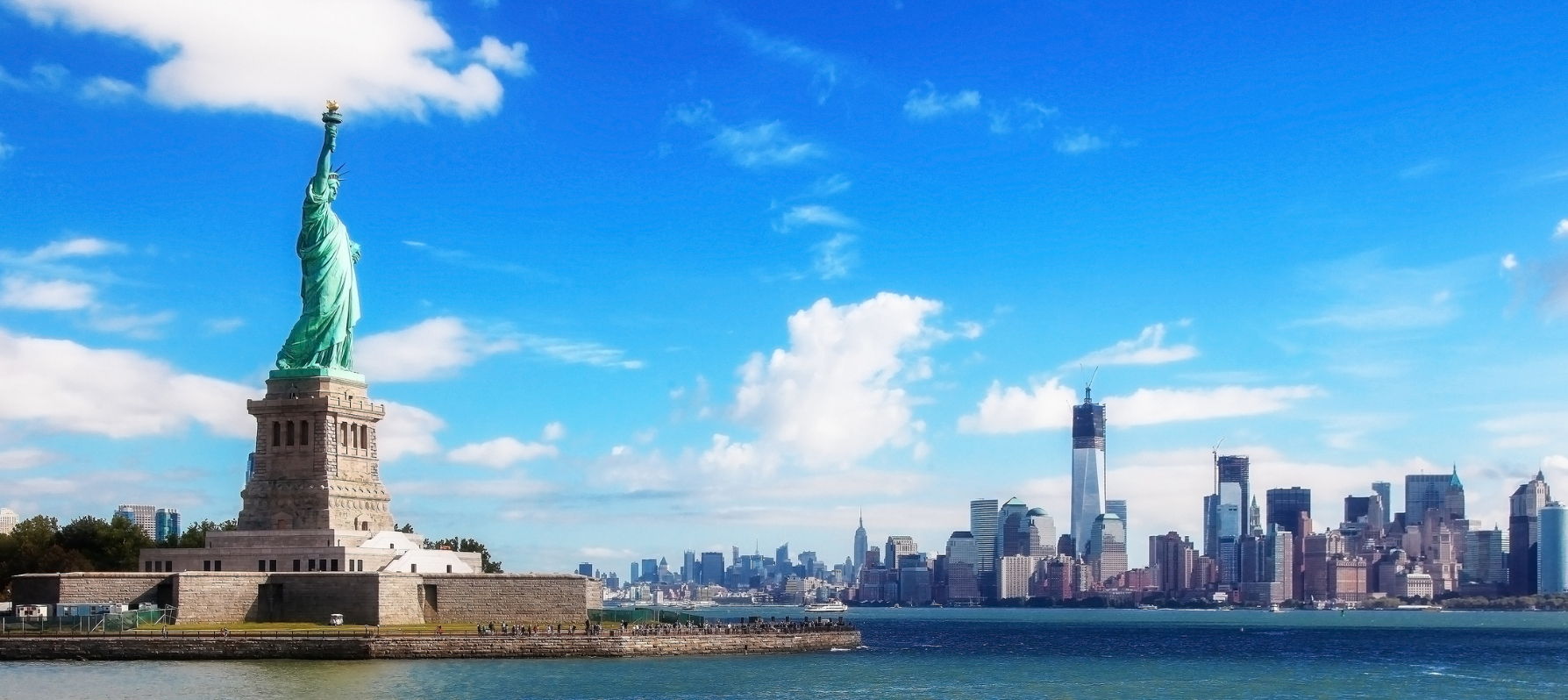 The Statue of Liberty in front of the NYC skyline