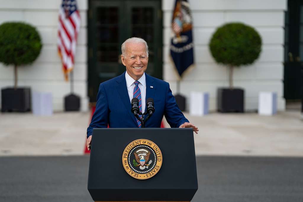President Joe Biden delivers remarks behind a podium