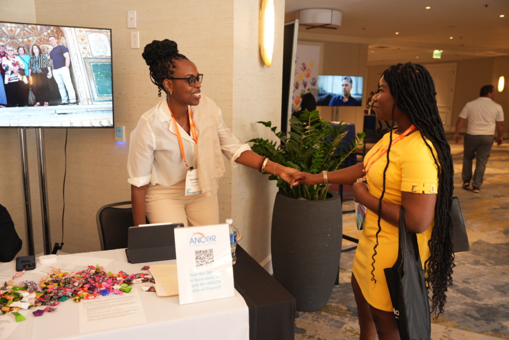attendees shaking hands at ANCOR Connect 25