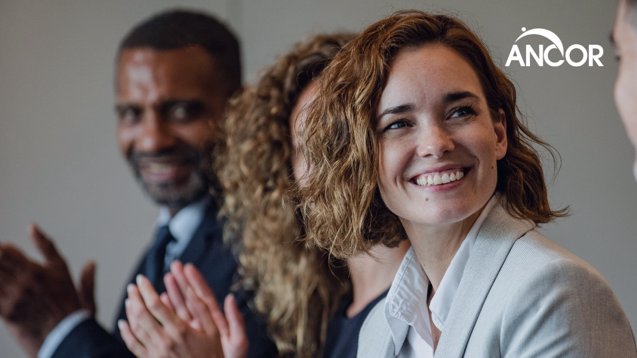 woman smiling at a networking event