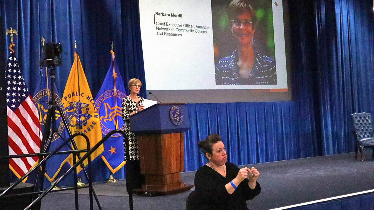 ANCOR CEO Barbara Merrill at a podium in the Dept of Health and Human Services speaking at an event hosted by ACL