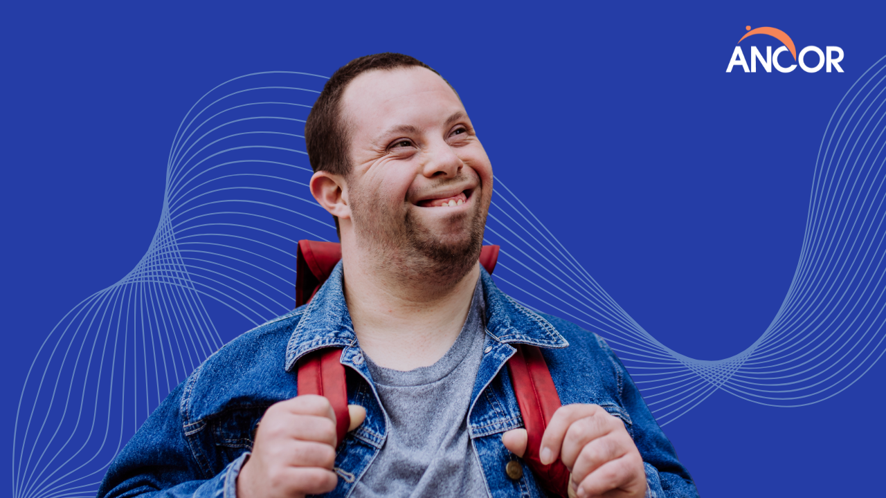 person with I/DD smiling while navigating in the community