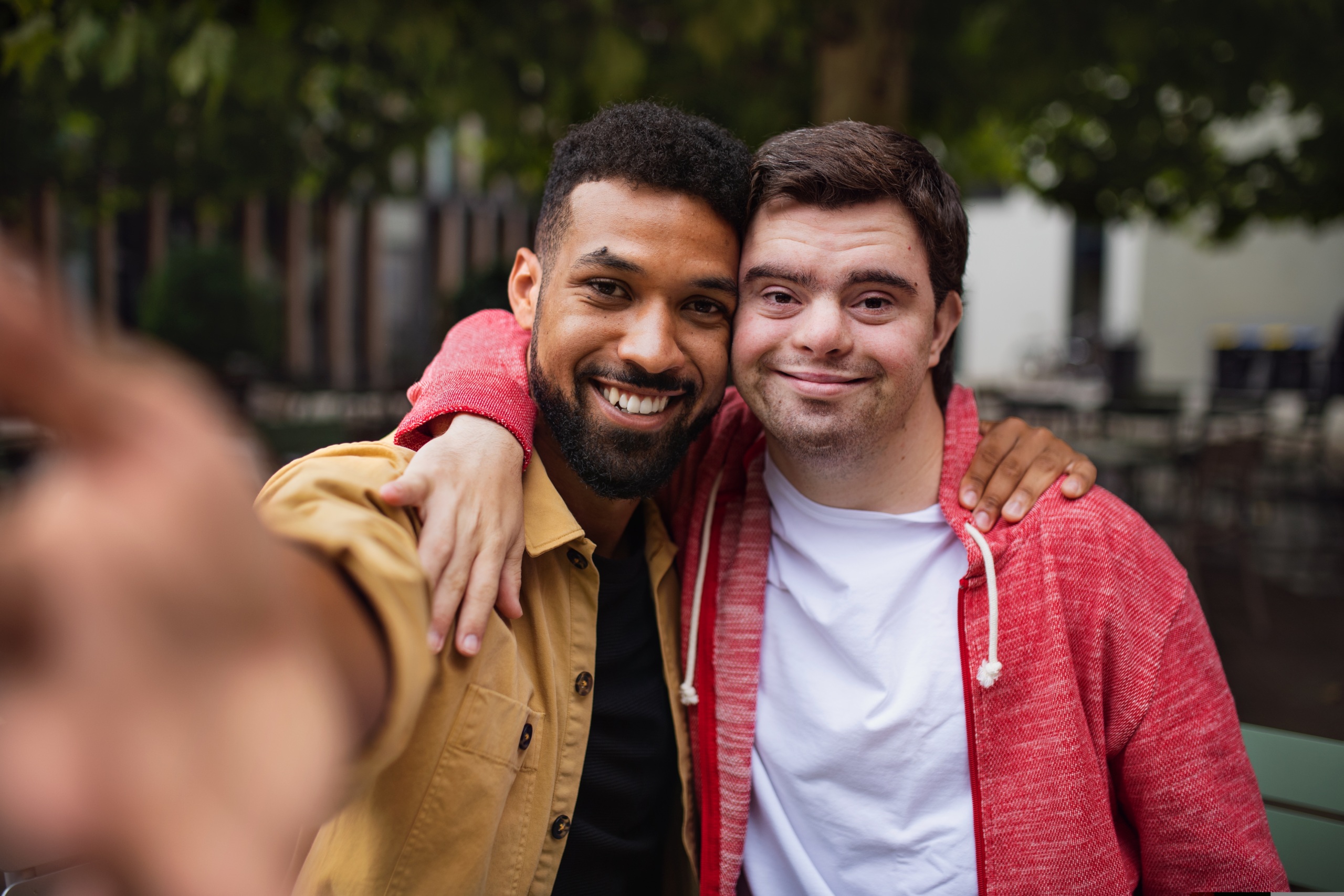 a DSP smiling next to a person with I/DD