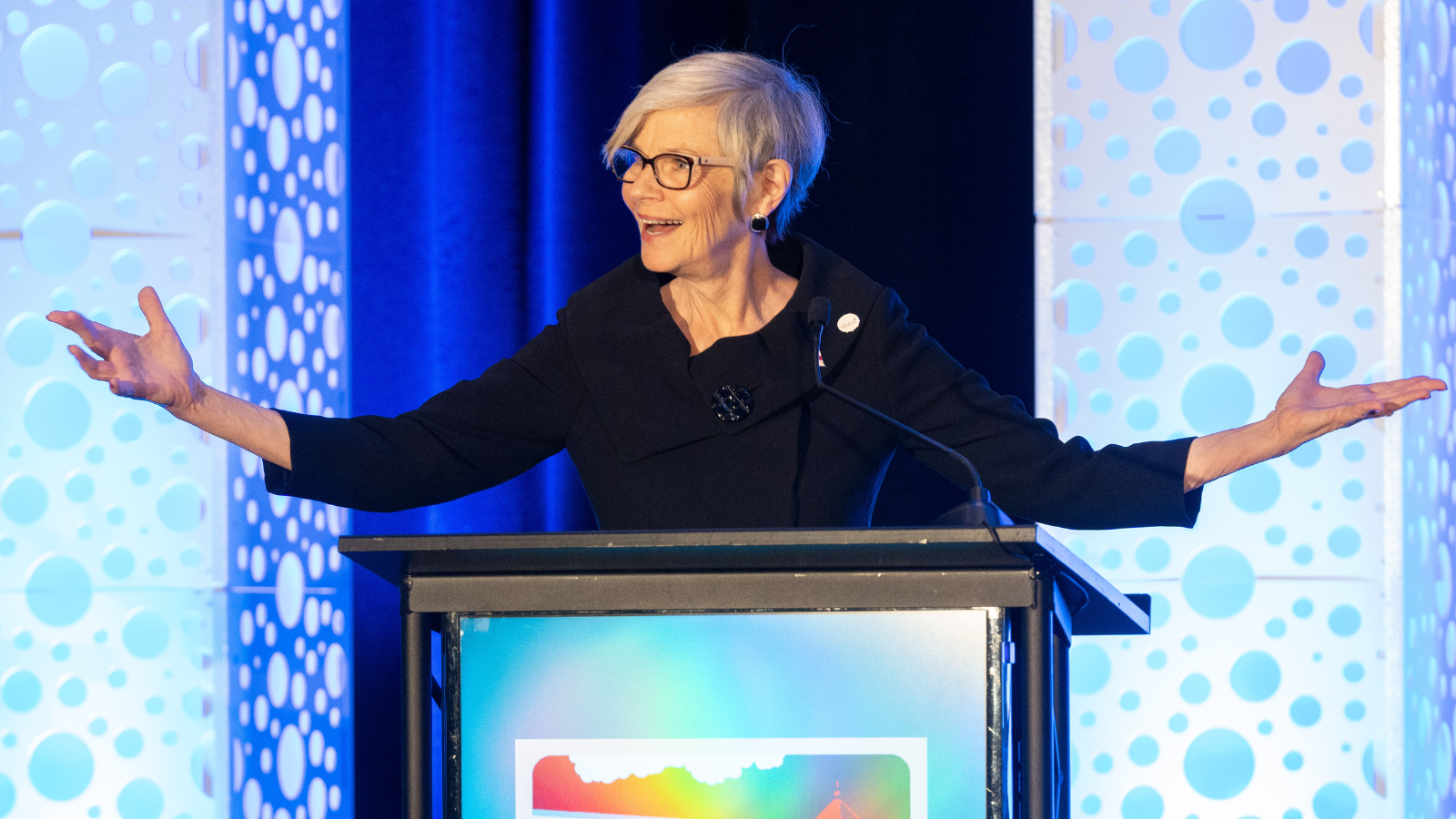 ANCOR CEO Barbara Merrill speaking on stage behind a podium at ANCOR Connect '26