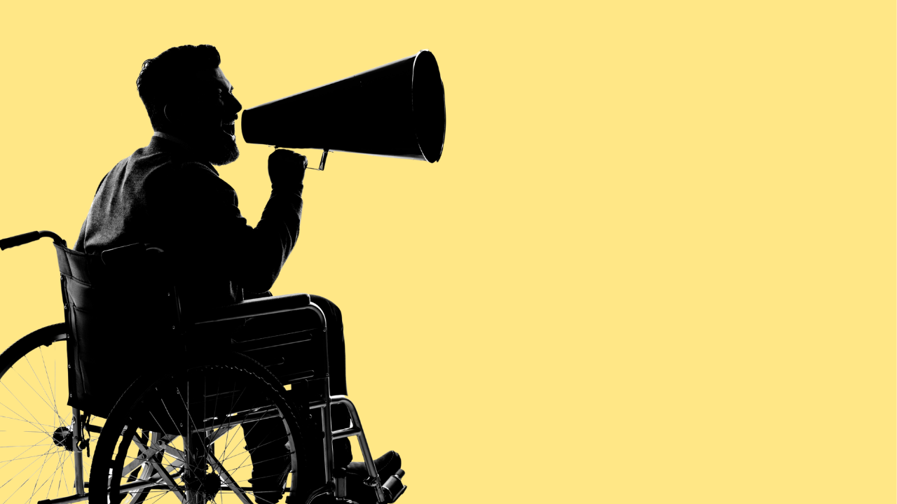 stock photo of a silhouette of a person in a wheelchair speaking through a bullhorn against a soft yellow background